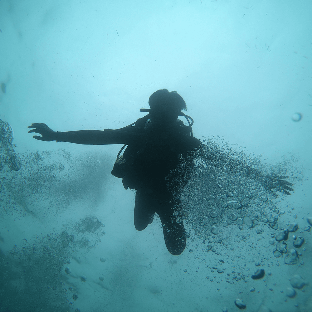 diver with bubbles underwater